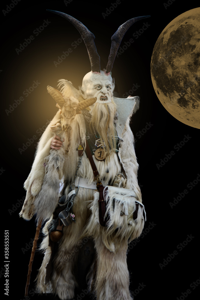 Spirit or Demon holding a stick at full moon