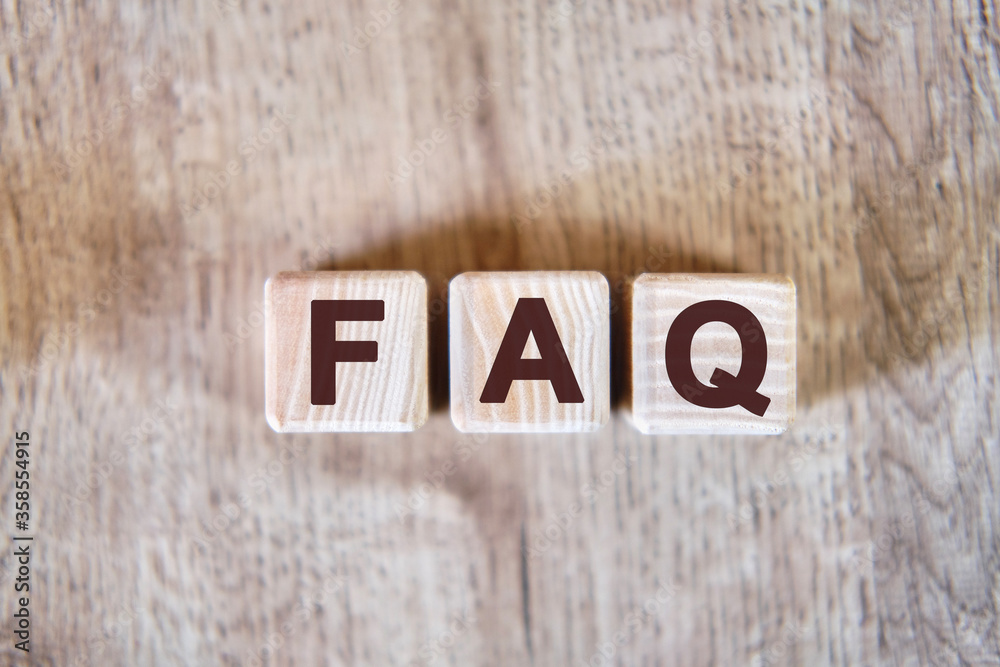 Fototapeta premium FAQ - text on wooden cubes, on wooden background