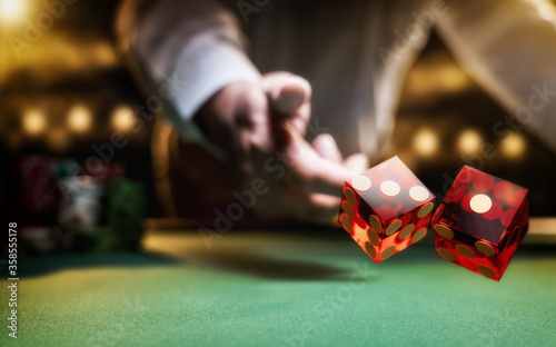 Man gambling at the craps table © Netfalls