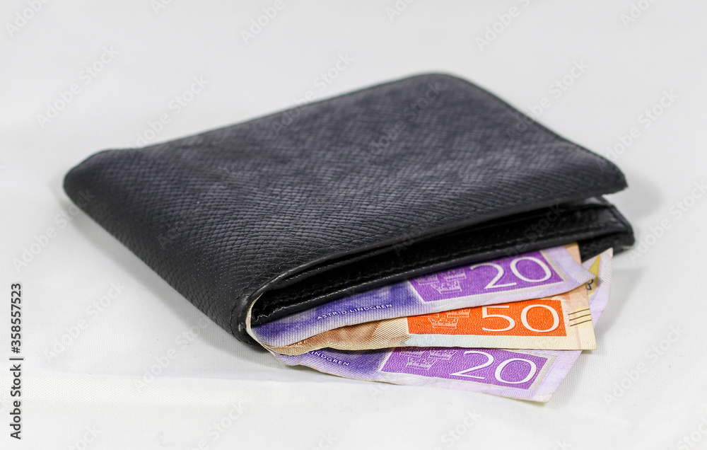 Wallet with Swedish money against a white background Wallet with Swedish money against a white background