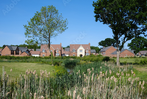 Fototapeta Naklejka Na Ścianę i Meble -  new housing estate beside a landscaped park in Shropshire, UK