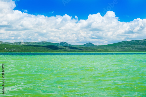 Beautiful green lake in ornithological nature park Vrana (Vransko jezero) in Dalmatia, Croatia photo