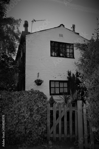black and white cottage in English village 