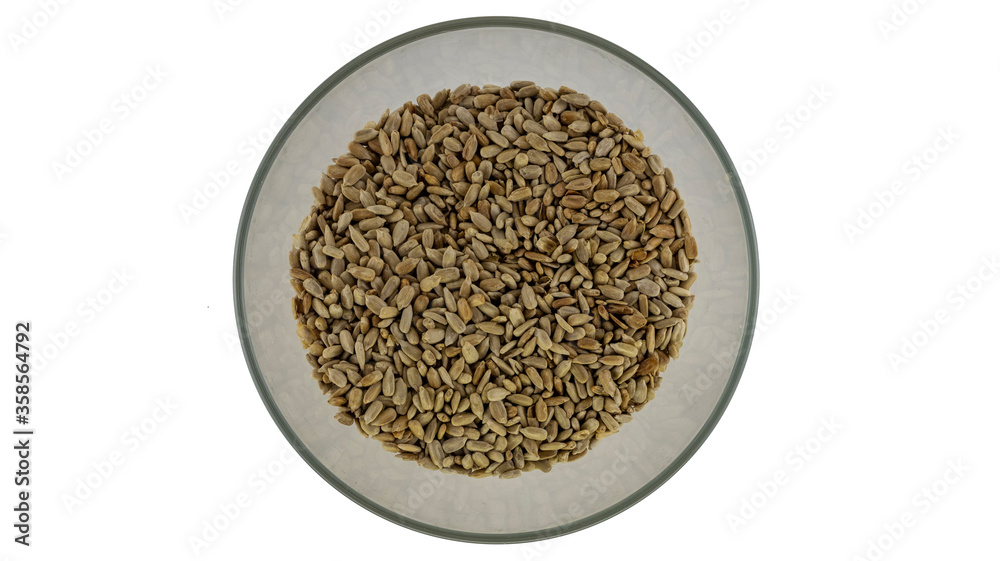peeled sunflower seeds in a plate on a white background peeled sunflower seeds in a plate on a white background