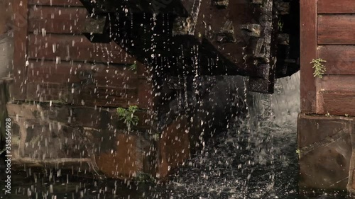 Close-Up of a Wooden Watermill in Slow Motion