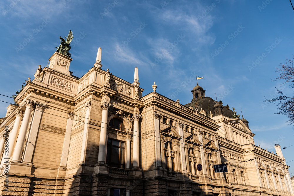 Lviv Theatre of Opera and Ballet in sunshine against blue sky