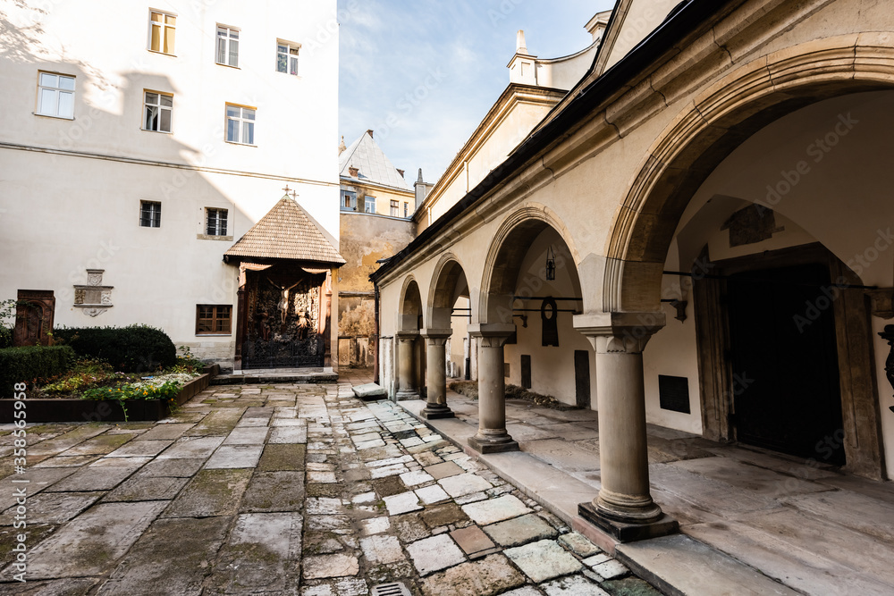 inner yard of carmelite monastery with arch gallery in lviv, ukraine
