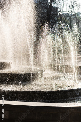 cascading fountain near trees in lviv, ukraine