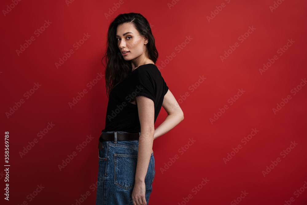 Photo of pleased woman in casual t-shirt posing and looking at camera