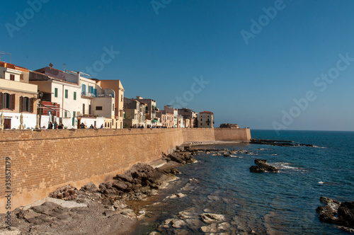 Waterfront with Mediterranean sea in the coastal town of Alghero during the sunset, Sardinia, Italy