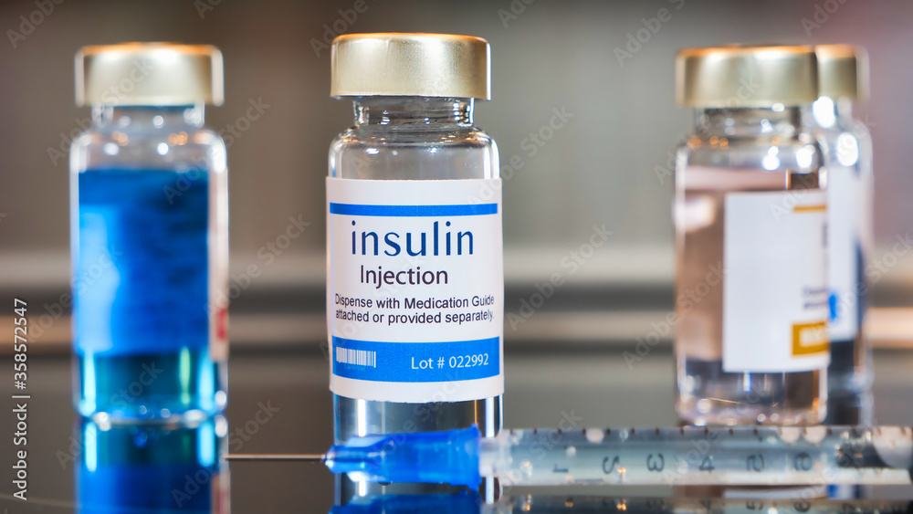 Vials of Insulin injection with a syringe Vials of Insulin injection with a syringe