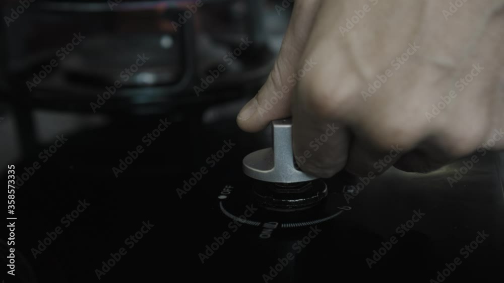 video of a black gas stove with blue and red burning flame in the kitchen video of a black gas stove with blue and red burning flame in the kitchen