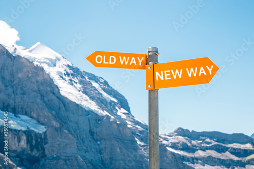 Obraz na płótnie Old way or new way choice text panel with snowy mountain background. Change challenge innovation business concept w salonie