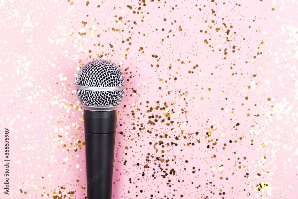 Stockfoto ASMR, karaoke, singing, recording concept. A microphone on blue background and falling gold confetti. Voice and sound magic. Minimal composition. | Adobe