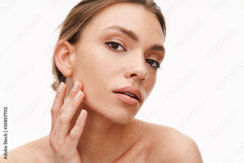 Image of beautiful caucasian young shirtless woman standing isolated