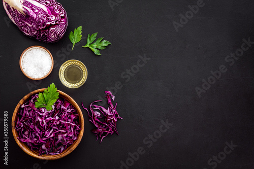 Red cabbage - coleslaw, cold-slaw - on black kitchen desk top-down copy space