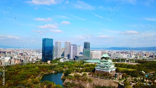 Osaka Castle - High aerial view in daytime by drone. The best ever landmark , Osaka - Japan [4k Resolution] photo