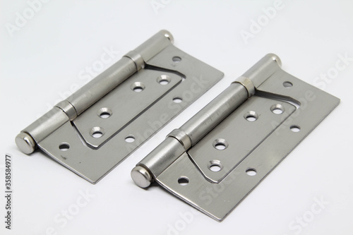 Stainless door hinge isolated on white background.
