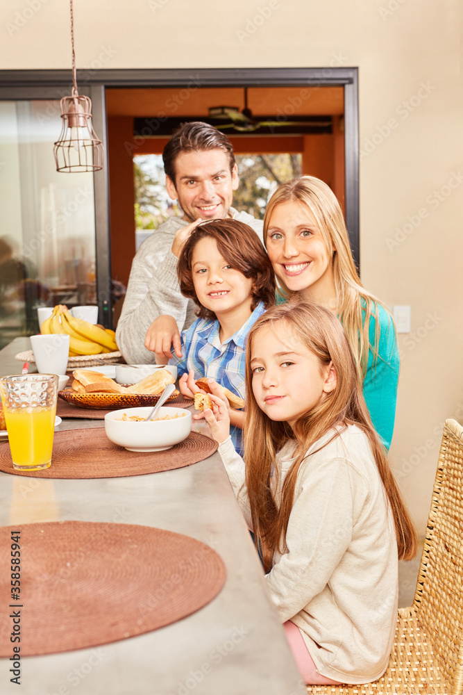 Family with two children having breakfast