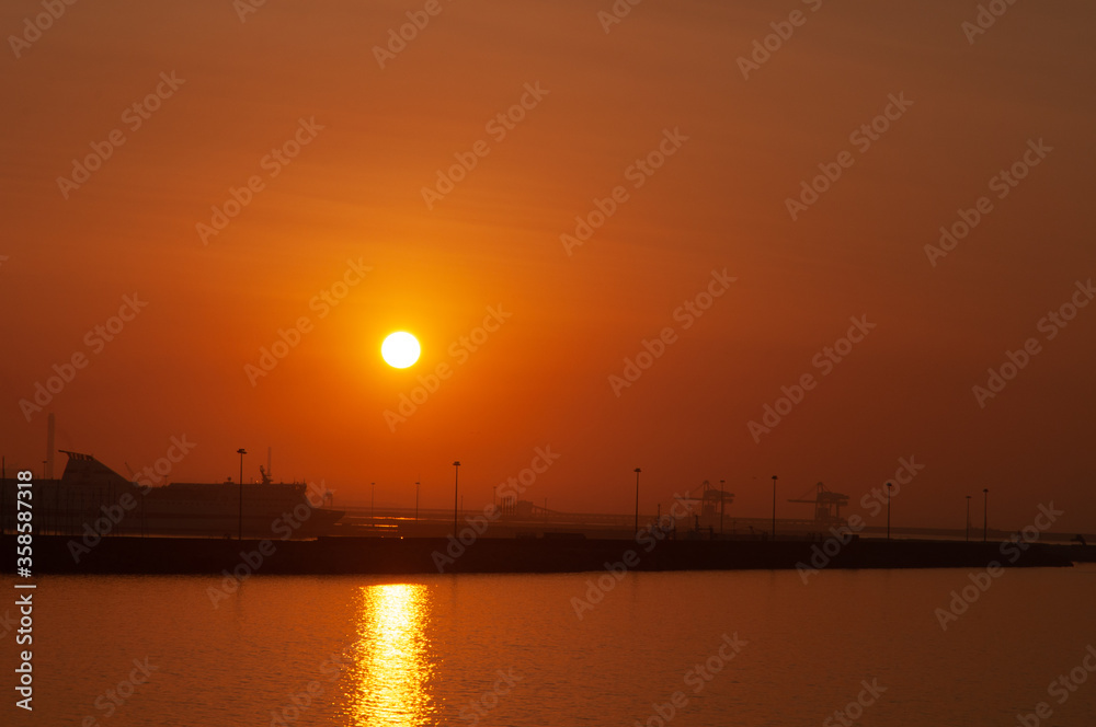 Beautiful Sunset over the Porto Torres harbour. Sardinia, Italy
