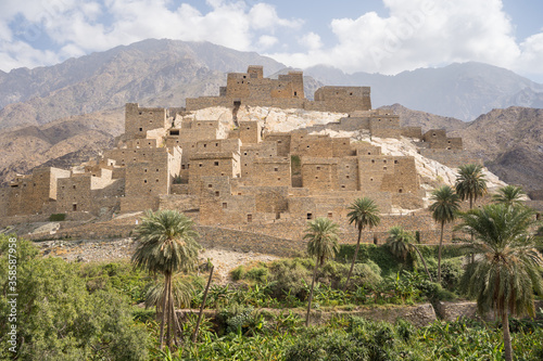 Amazing landscape of remote ancient Marble Village in Al Bahah locating against cloudy sky in summer cloudy day in Saudi Arabia photo