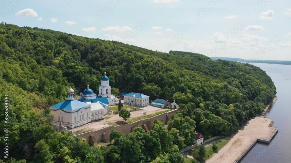 Makaryev monastery in Russia near the river surrounded by green forest Makaryev monastery in Russia near the river surrounded by green forest