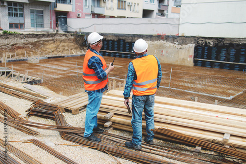 Managers, engineers discuss the further process of work on the construction site