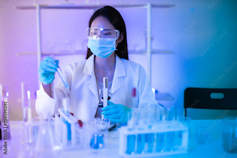 The scientist doctor created a vaccine against the coronavirus.Coronavirus 2019-nCoV Blood Sample. virus outbreaking.Technician holding blood tube test in the research laboratory The scientist doctor created a vaccine against the coronavirus.Coronavirus 2019-nCoV Blood Sample. virus outbreaking.Technician holding blood tube test in the research laboratory