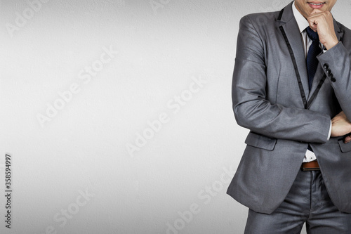 Businessman in suit on gray background.The boss have vision and leadership for strategy in business to success in market mechanism concept.