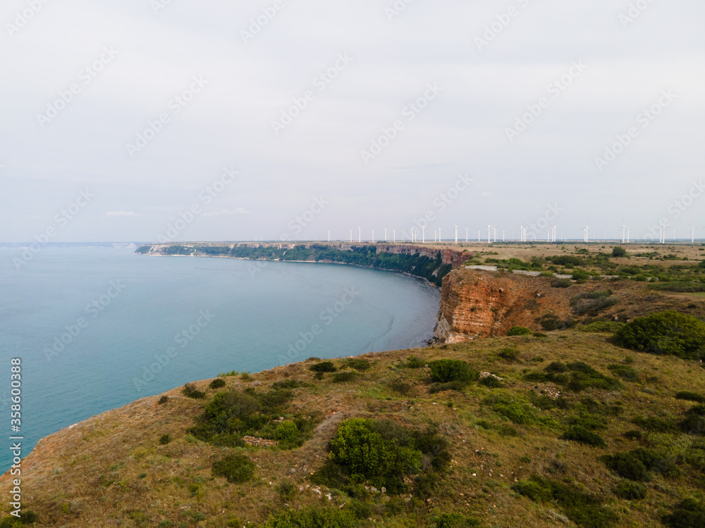 Aerial view landscape of headland sea and wind turbines background