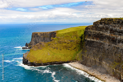 Spectacular view of the Cliffs of Moher (Aillte an Mhothair), edge of the Burren region in County Clare, Ireland. Great touristic attraction photo
