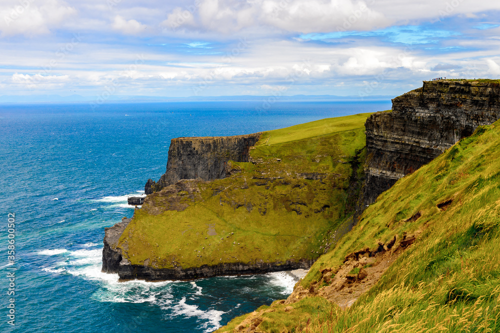 Spectacular view of the Cliffs of Moher (Aillte an Mhothair), edge of the Burren region in County Clare, Ireland. Great touristic attraction