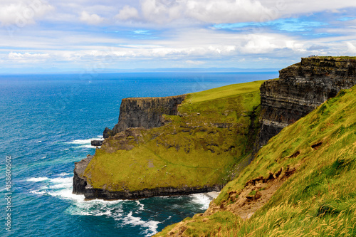 Spectacular view of the Cliffs of Moher (Aillte an Mhothair), edge of the Burren region in County Clare, Ireland. Great touristic attraction