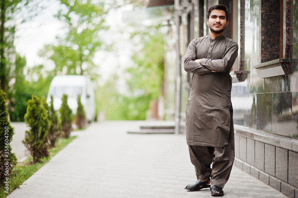 Indo pakistani man wear traditional clothes achkan or sherwani.