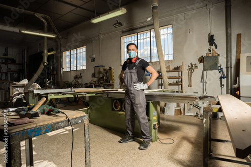 Worker looking at camera in a factory.