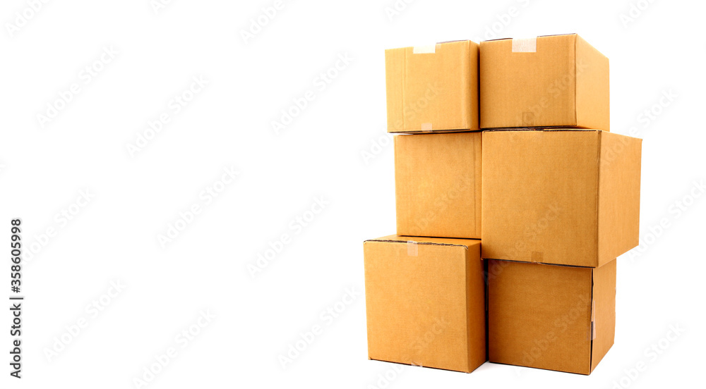 Obraz premium A stack of cardboard boxes on white background in studio,courier service concept.