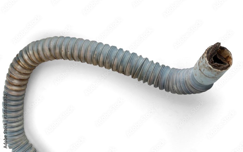 Clogged plastic corrugated drain hose. Isolated on a white background. Clogged plastic corrugated drain hose. Isolated on a white background.
