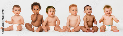 Vászonkép Row of six multi ethnic Babies smiling in studio