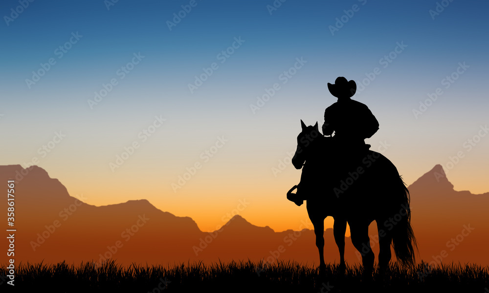 Fototapeta premium Cowboys on horseback at sunset