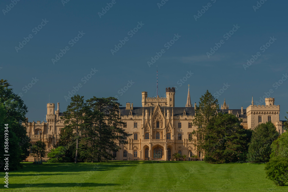 Fototapeta premium Lednice castle with fresh color spring garden in sunny morning
