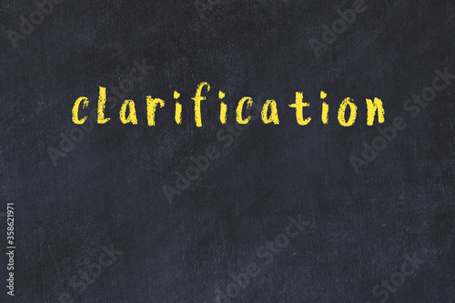 Black chalkboard with inscription clarification on in