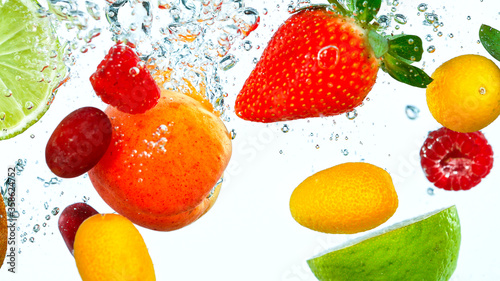 Fototapeta Naklejka Na Ścianę i Meble -  Freeze Motion Shot of Fresh Fruits Falling Into Water Isolated on White Background.