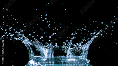 Water splash isolated on black background, freeze motion