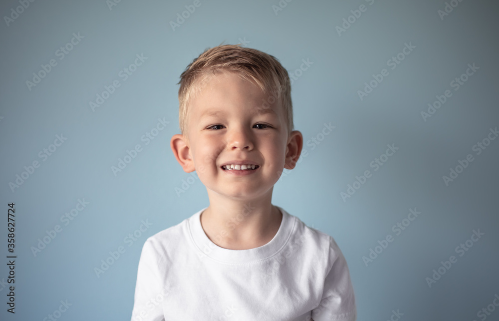 Portrait of cute blond boy smiling in studio Portrait of cute blond boy smiling in studio