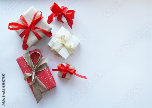 Present gift boxes with bow on white background.