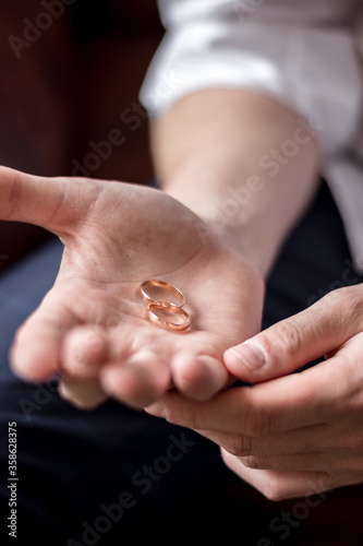 hands of the groom and the bride with rings