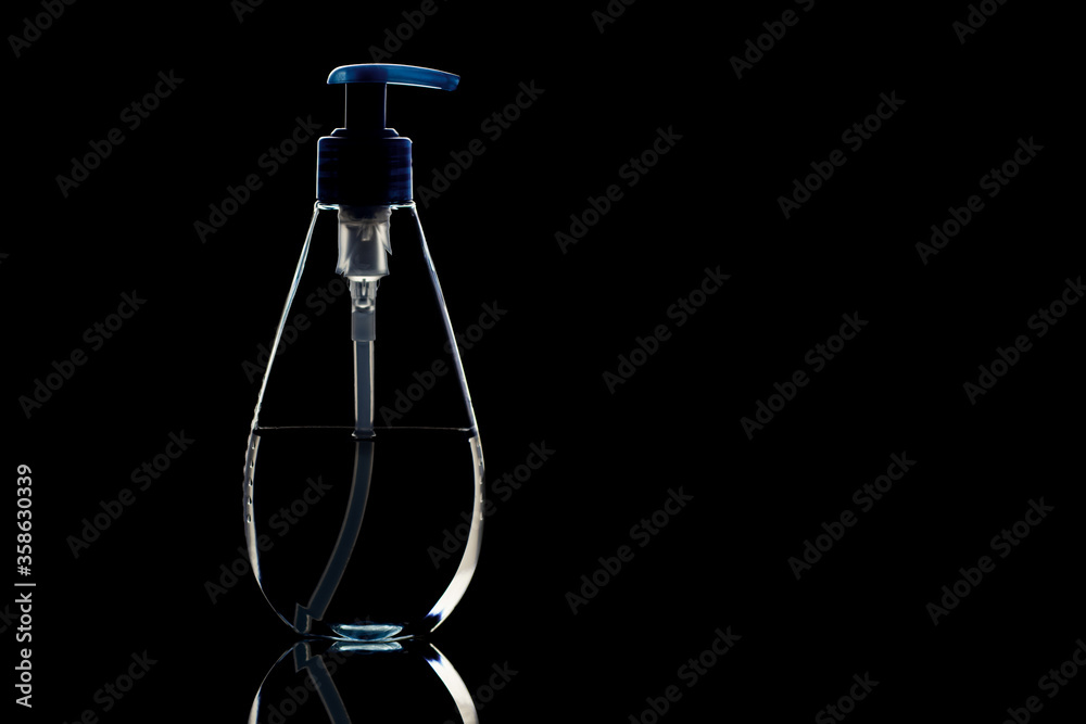 antiseptic gel for hand disinfection dispenser is isolated on a black background. the concept of personal hygiene. isolated on a black background
