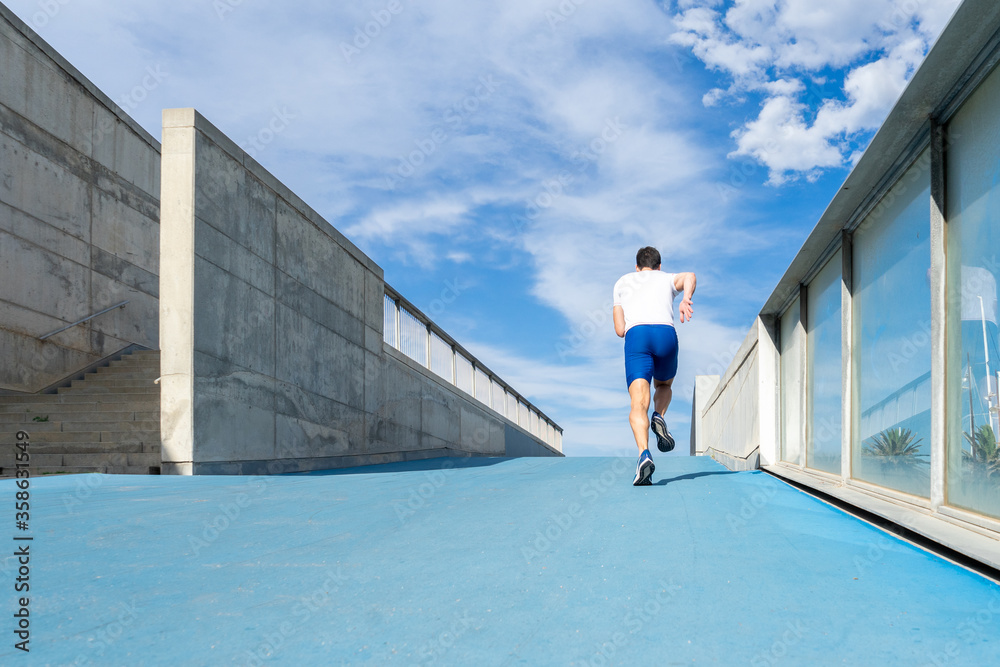 Young man running, motivation concept Young man running, motivation concept