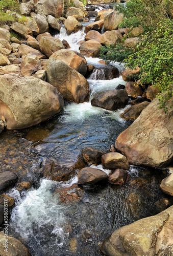 Landscape of a waterfall with big rocks.