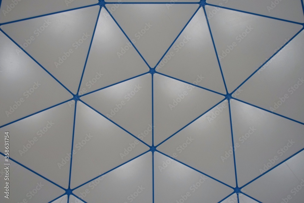 Gray and blue triangular pattern on a roof. Gray and blue triangular pattern on a roof.